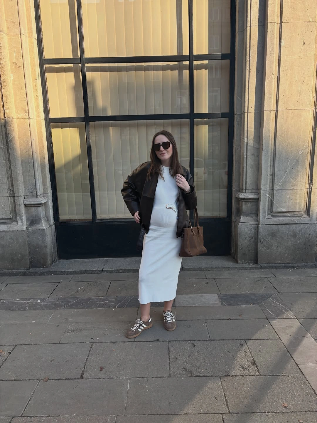 fall pregnancy outfits 2026 Minimal White Dresses Become Even Better with a Leather Jacket