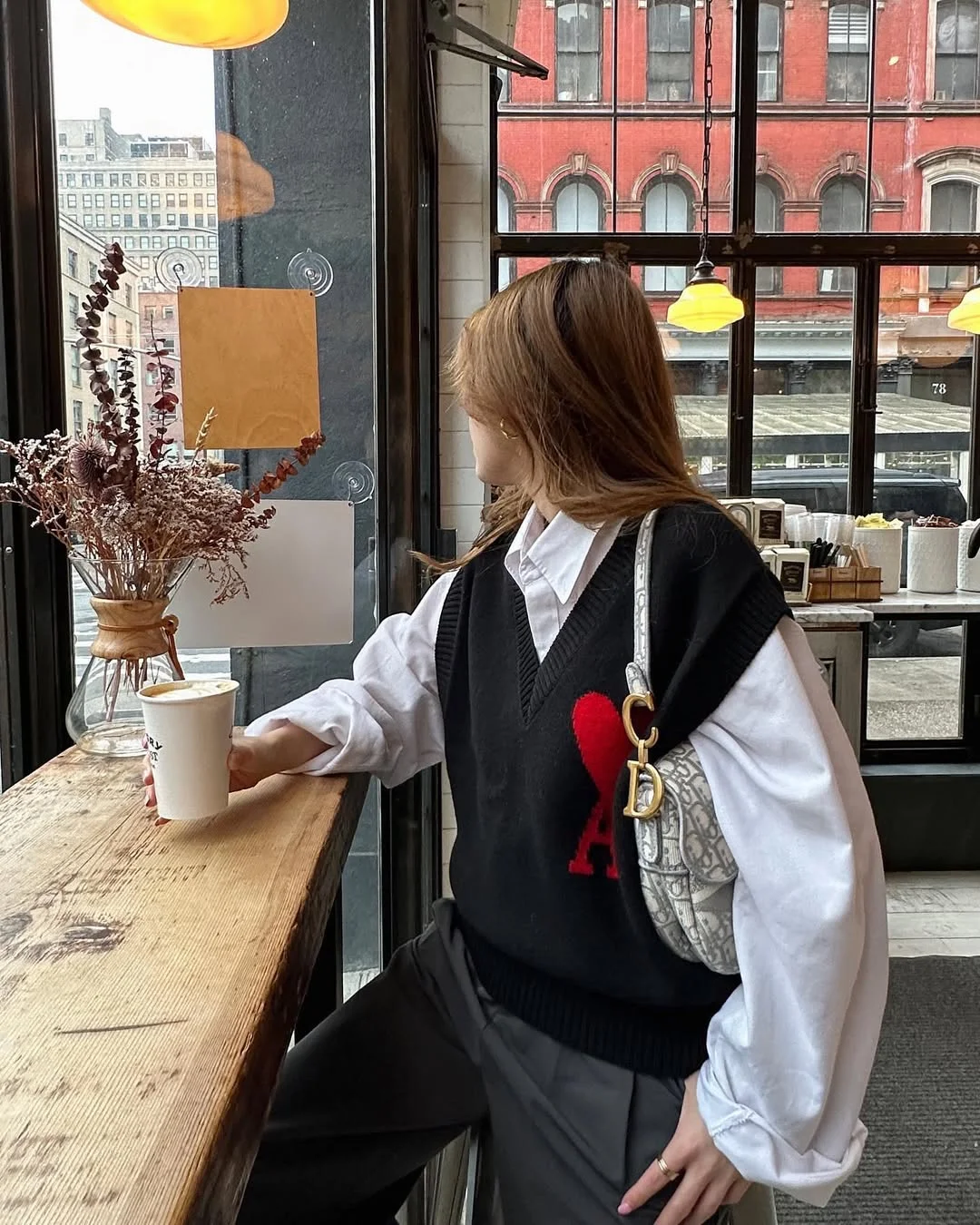 fall vest outfits for women 2026 Black Sweater Vest with an Oversized Shirt for Café Days