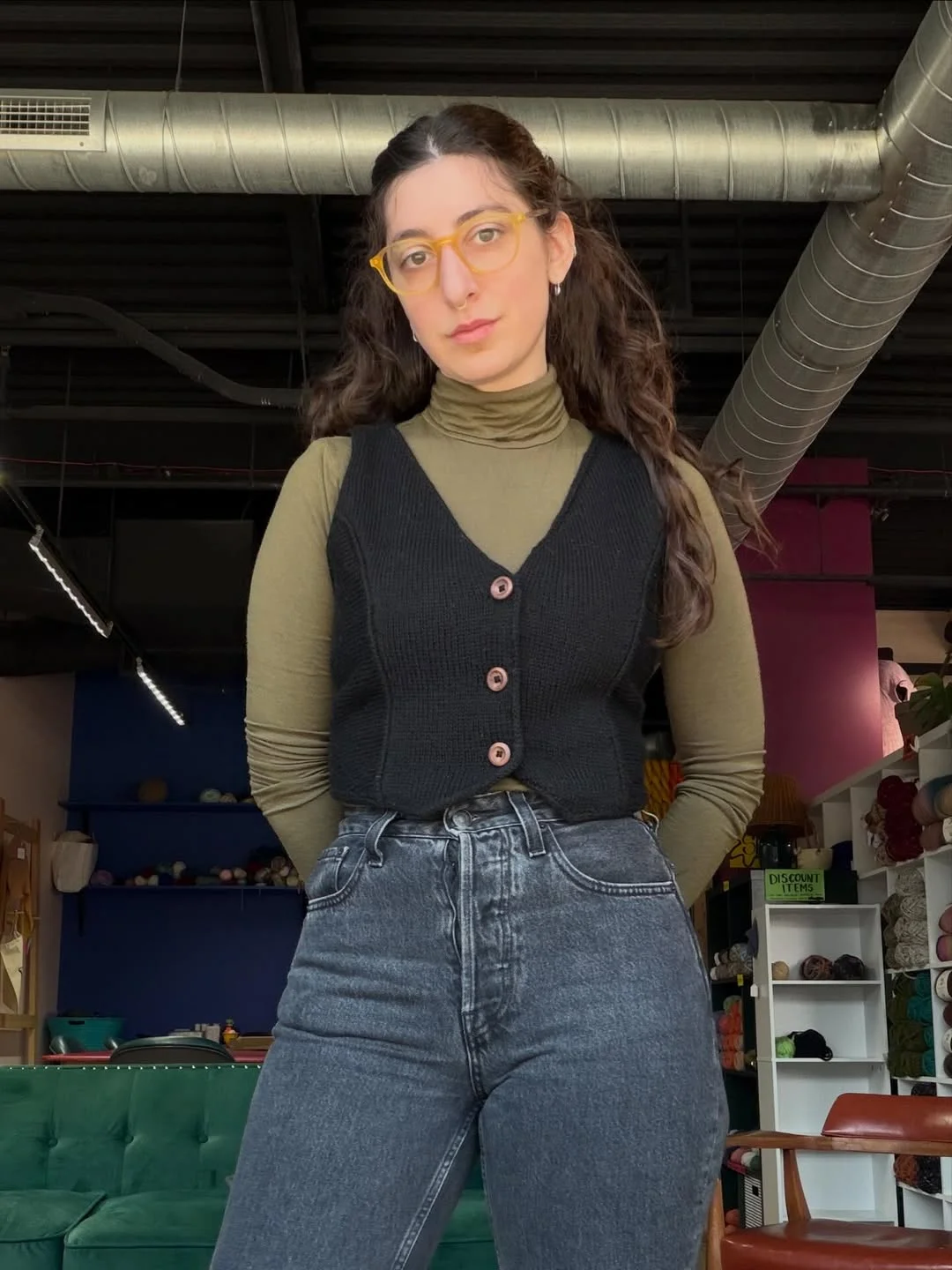 fall vest outfits for women 2026 Minimal Black Knitted Vest with an Olive Turtleneck