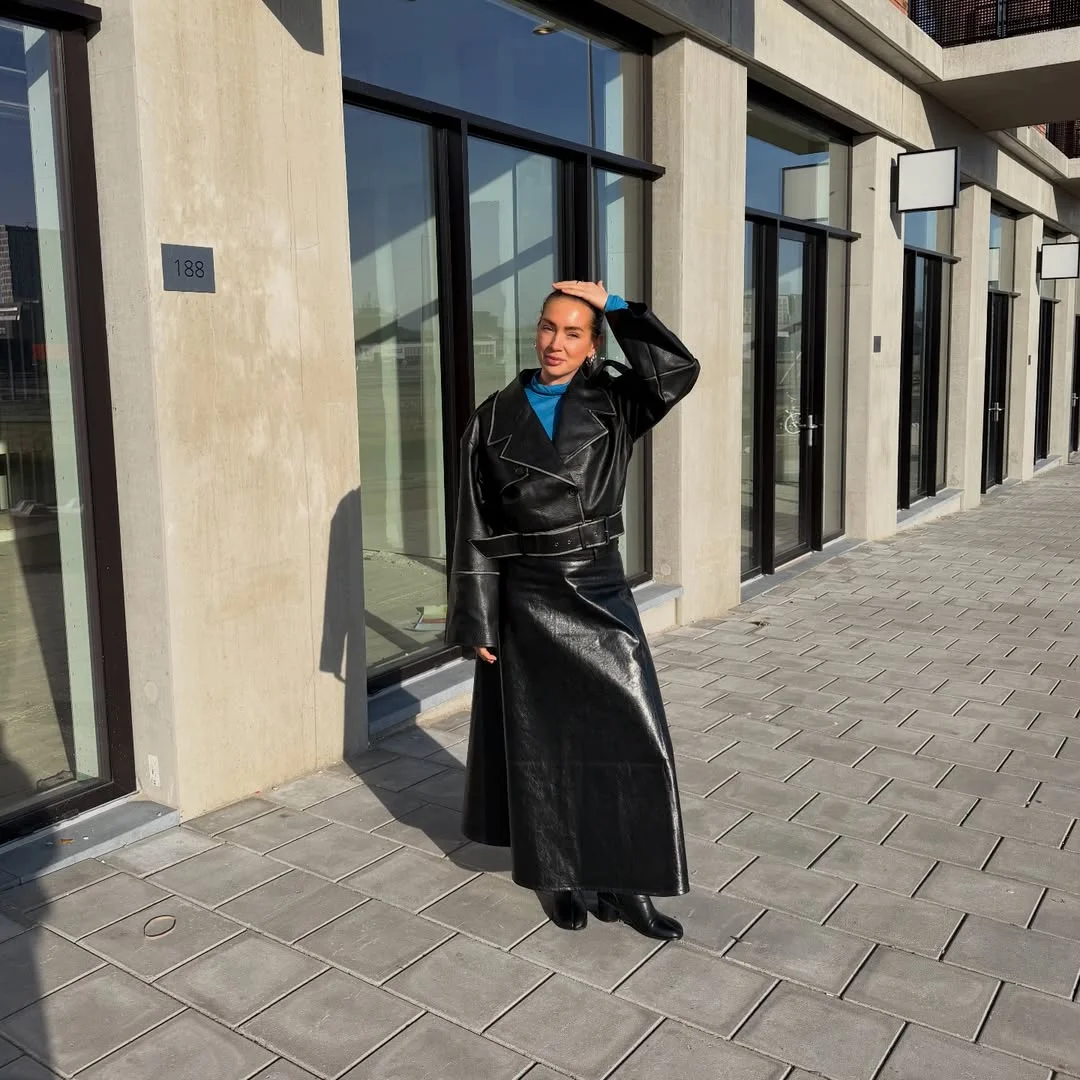 fall work outfits 2026 Black Leather Coat With A Blue Knit Accent