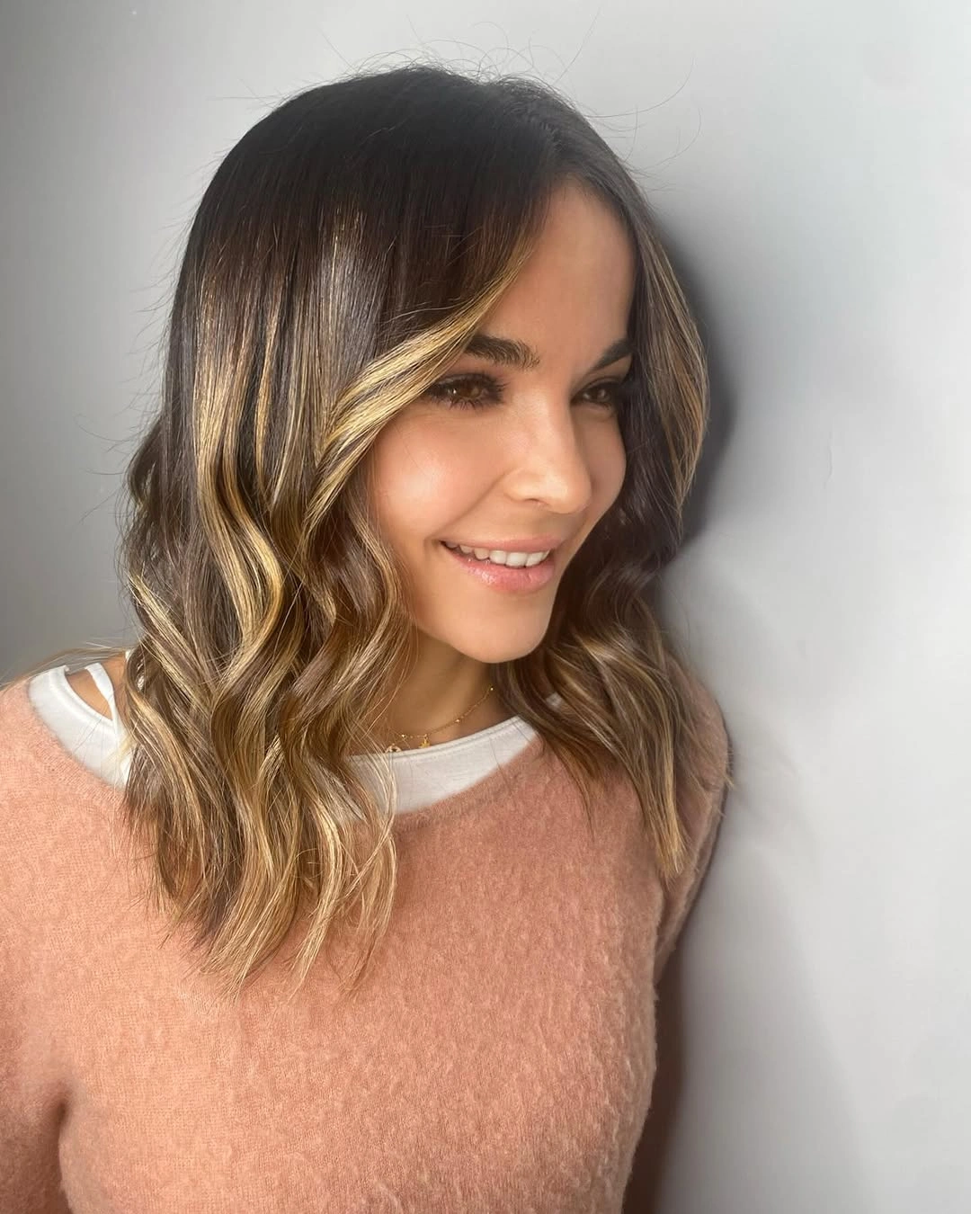 august hairstyles and color ideas 2026 Dimensional Brunette Waves With Golden Face Highlights