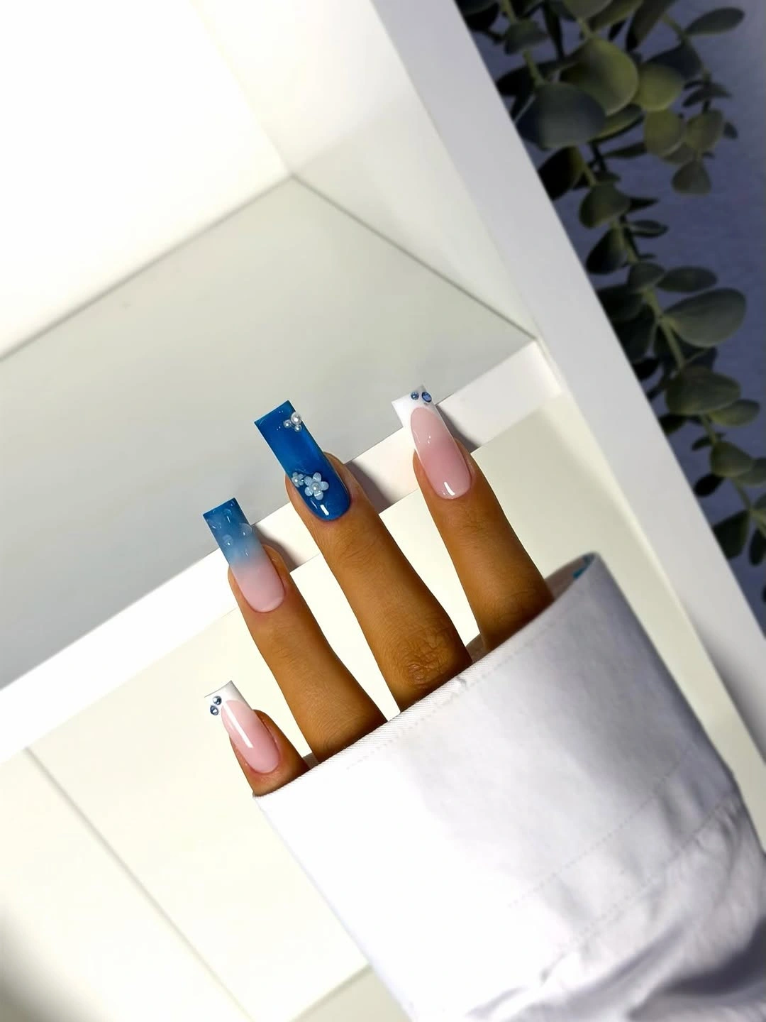 august nails color 2026 Blue Ombre Nails with Floral Accents That Feel Fresh and Elegant