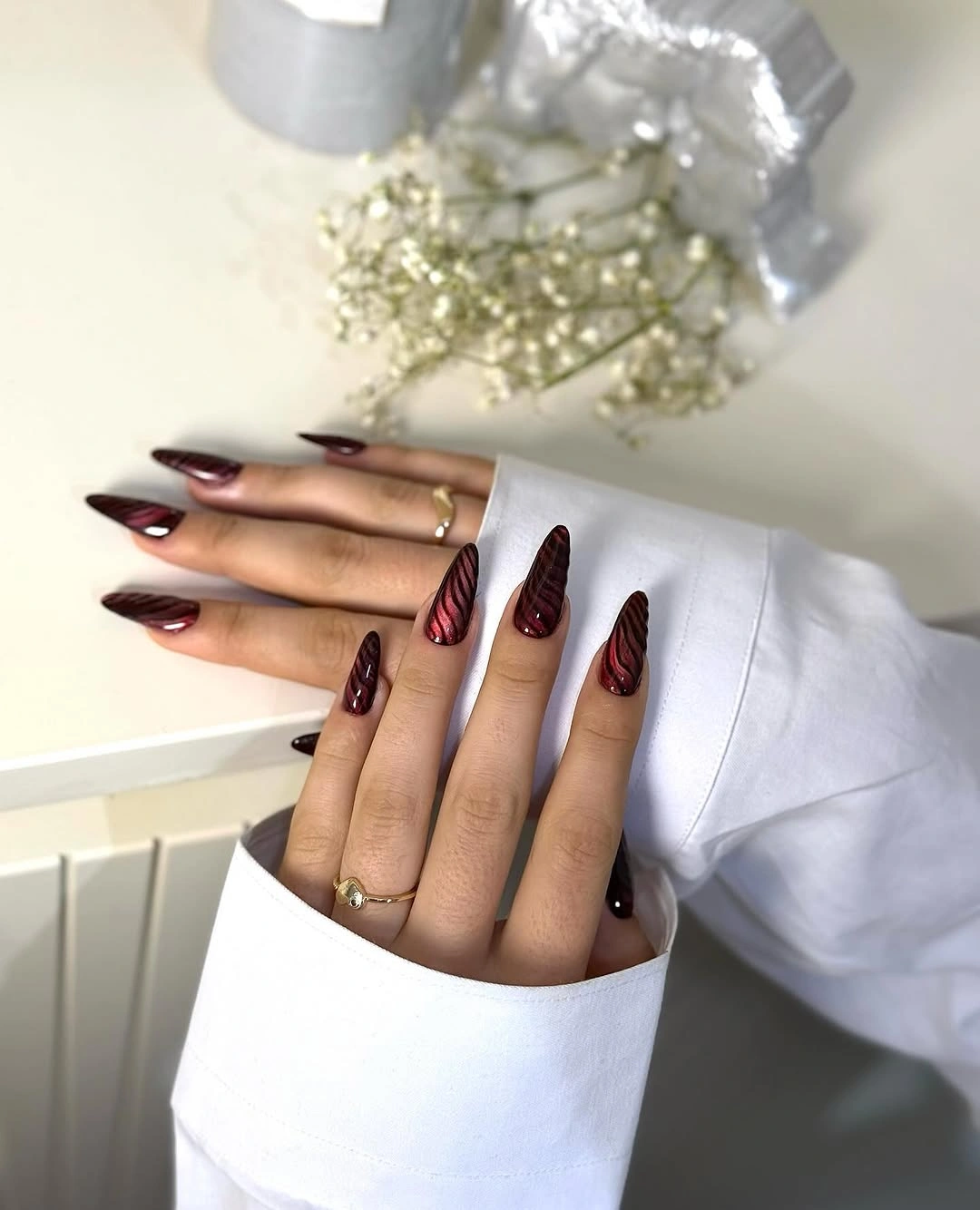 august nails color 2026 Deep Burgundy Cat-Eye Nails That Welcome the First Hint of Fall