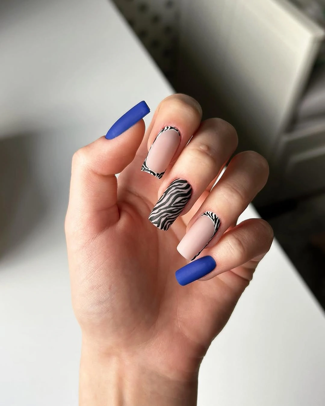august nails ideas 2026 Electric Blue and Zebra Print for a Statement Look