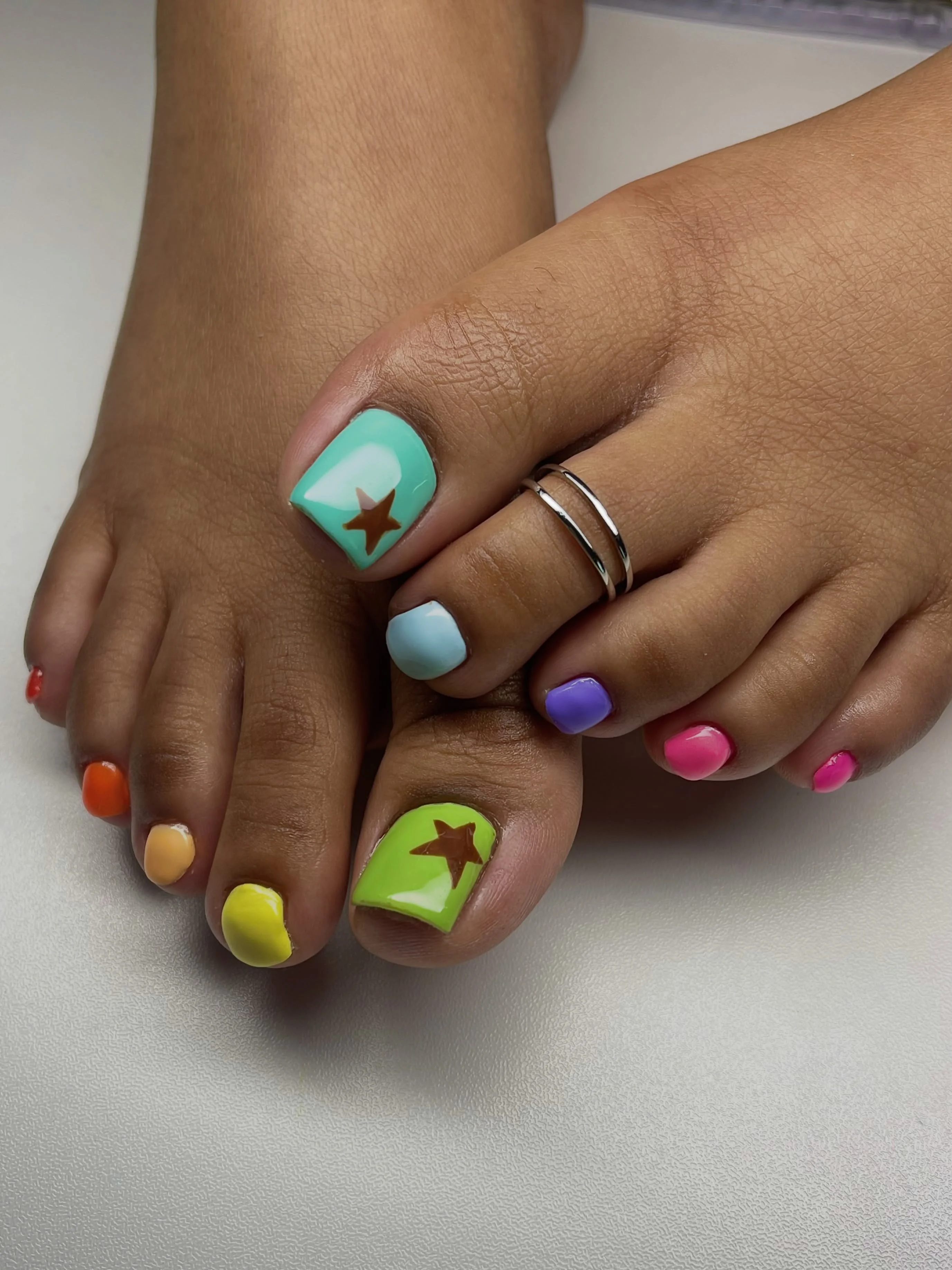 august toe nails 2026 Playful Rainbow Toe Nails With Vacation Energy