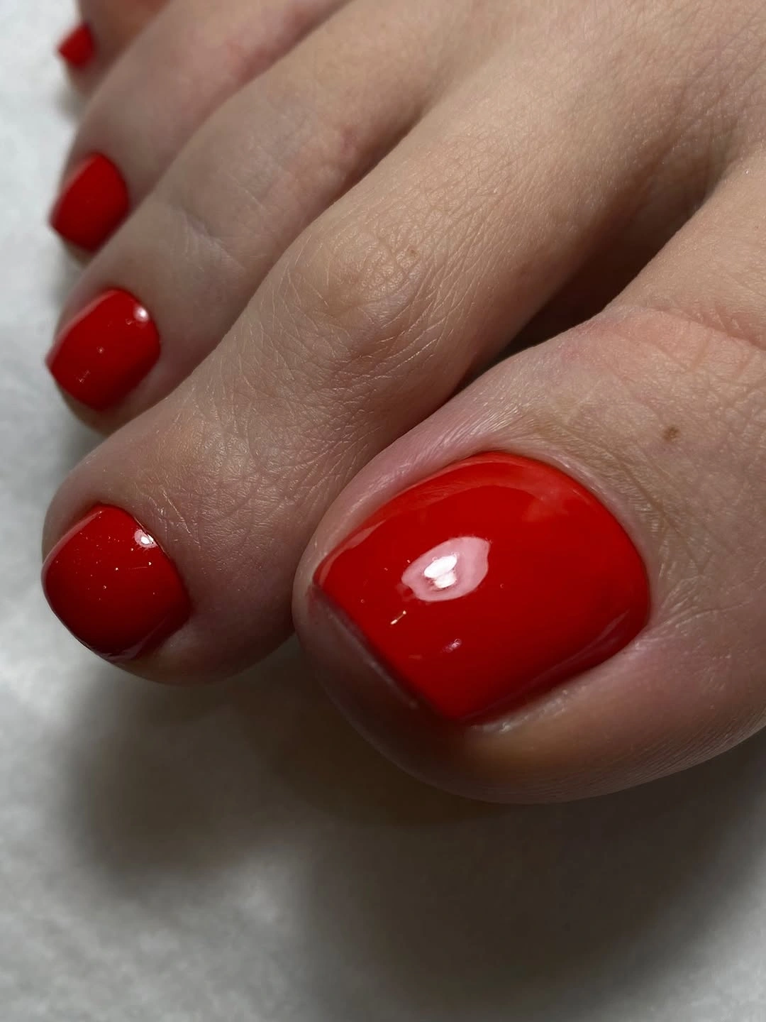 august toe nails 2026 Classic Glossy Red Toe Nails That Never Leave Style