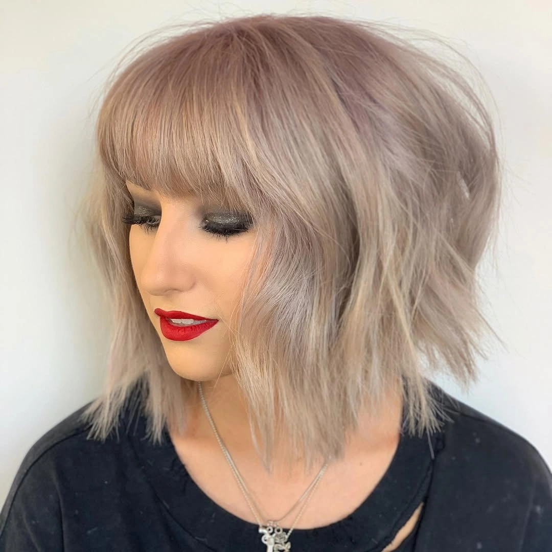 bobbed haircut for women Shaggy Platinum Bob with Wispy Fringe