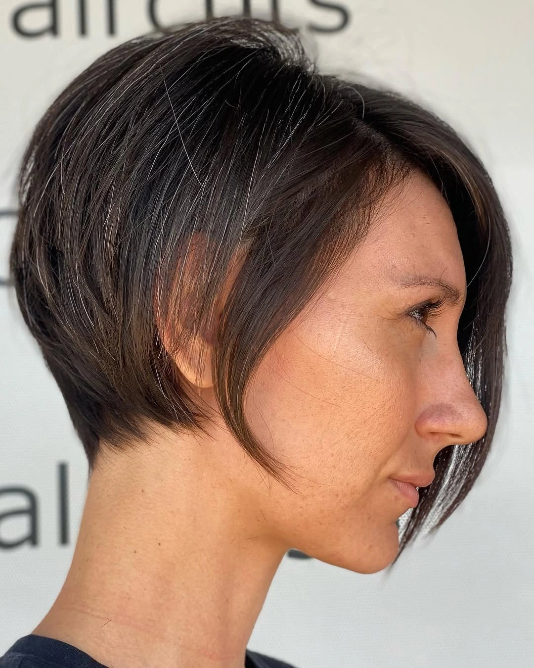 bobbed haircut for women Stacked Brunette Bob with Elegant Side Sweep