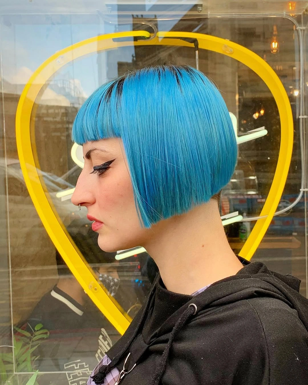 bobbed haircut for women Bold Graphic Bob with Electric Blue Precision Color