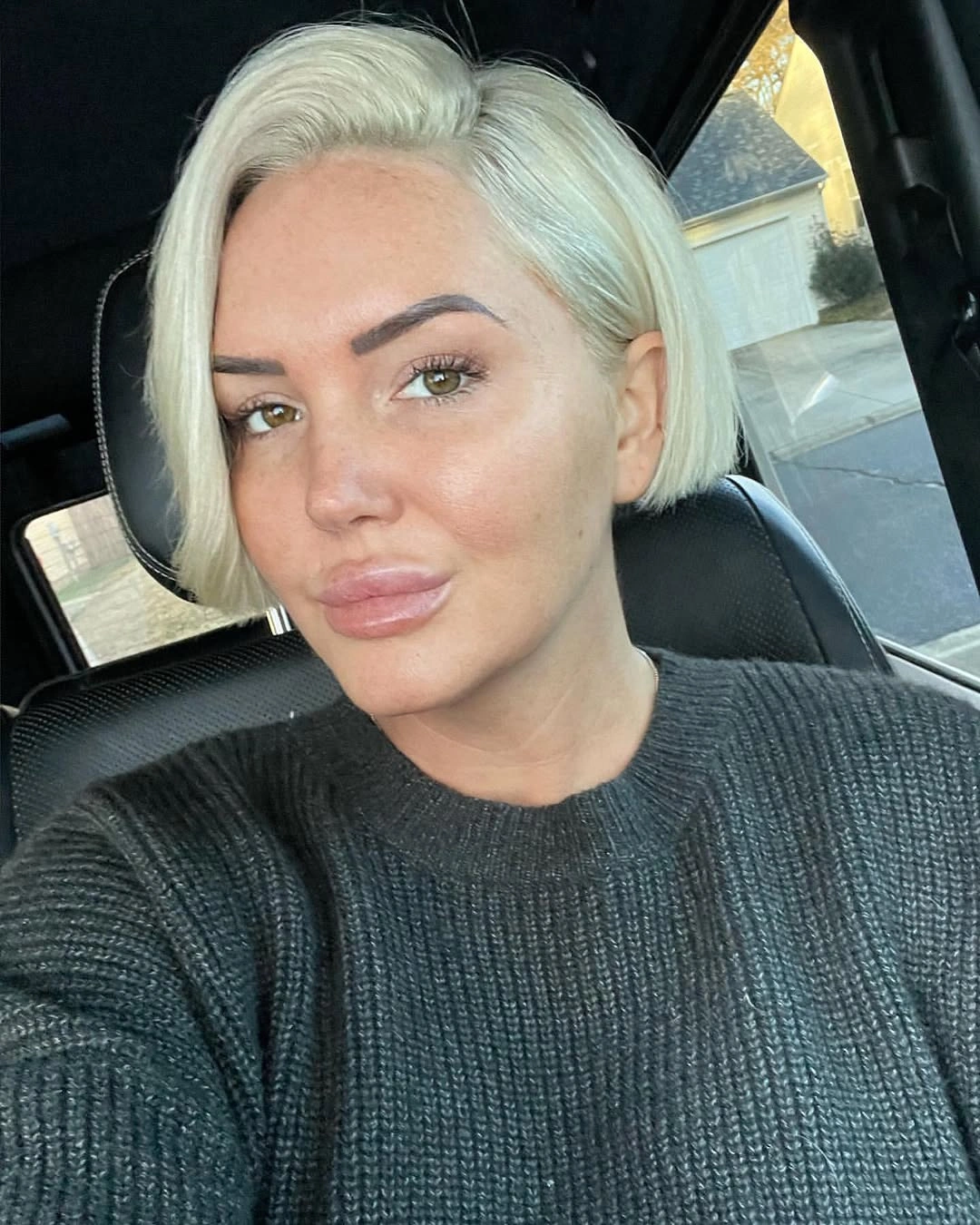 bobbed haircut for women Platinum Side-Part Bob with Modern Minimalism