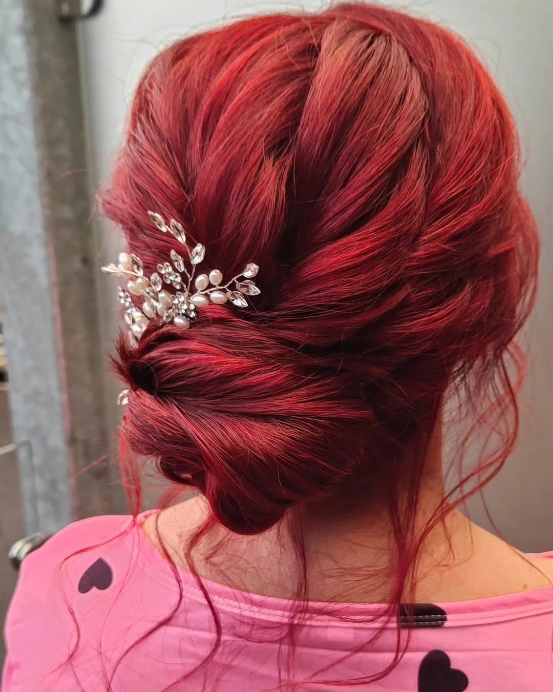 bridesmaid hairstyling Bold Ruby Red Updo That Makes a Statement