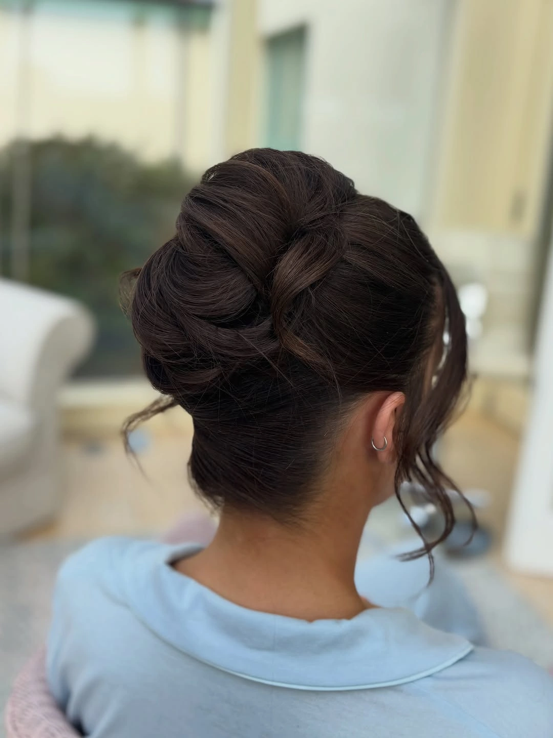 bridesmaid hairstyling Elegant Sculpted Bun for a Sophisticated Bridal Party