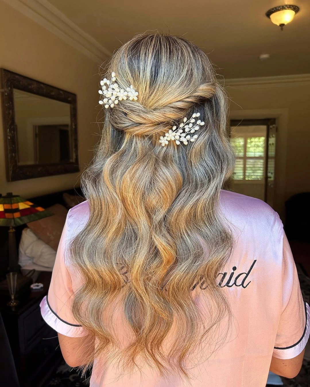 bridesmaid hairstyling Romantic Half-Up Waves with Pearl Accents