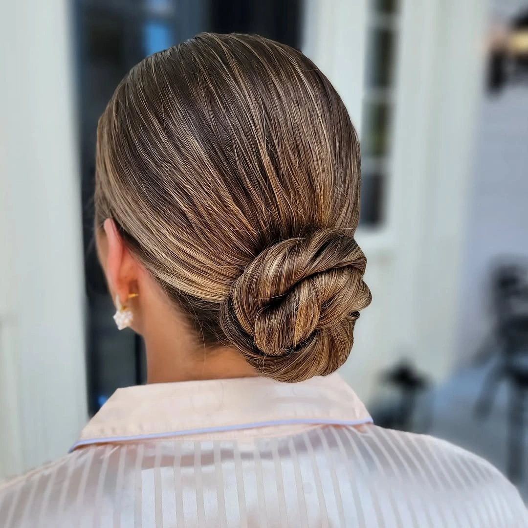 bridesmaid hairstyling Timeless Sleek Knot for an Elegant Bridesmaid Look
