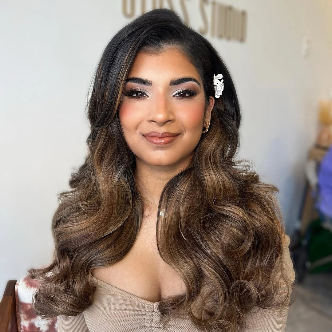bridesmaid hairstyling Soft Hollywood Waves with a Romantic Floral Accent