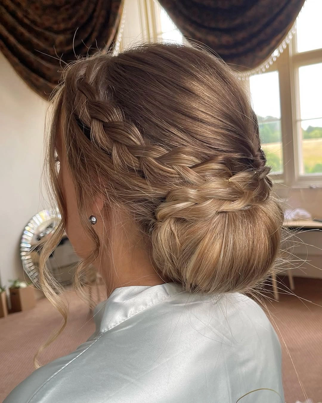 bridesmaid hairstyling Classic Braided Low Bun for Elegant Ceremonies