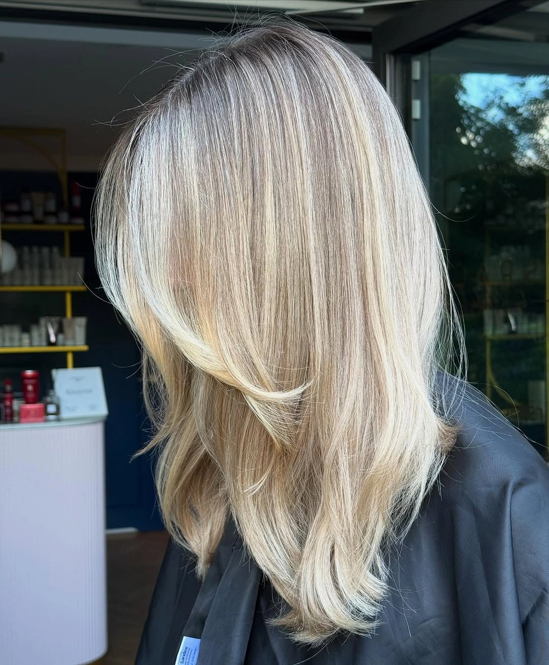 choppy medium layered hair Polished Blonde Midi Cut with Airy Choppy Ends