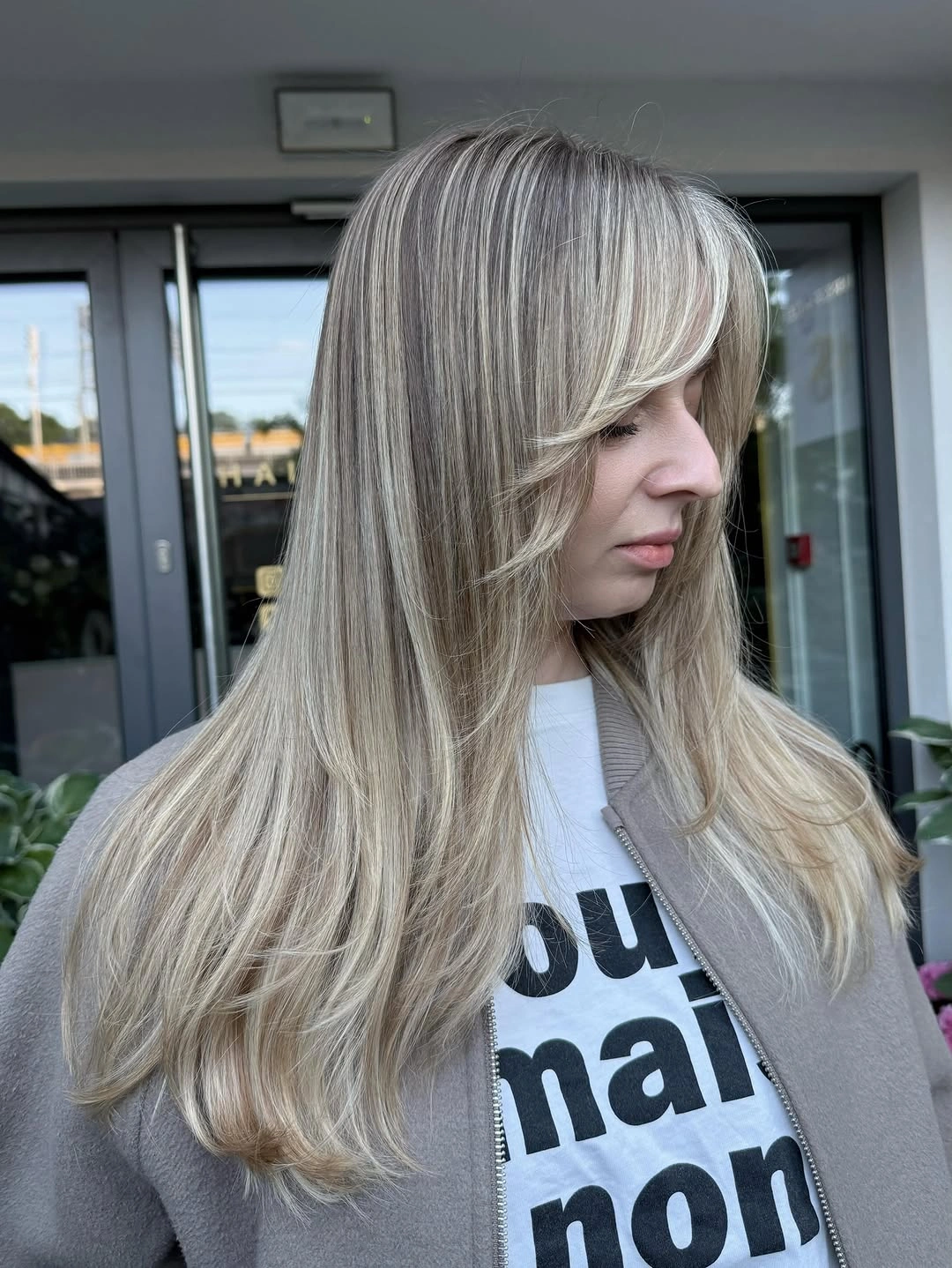 choppy medium layered hair Silvery Blonde Layers with Soft Side-Swept Bangs