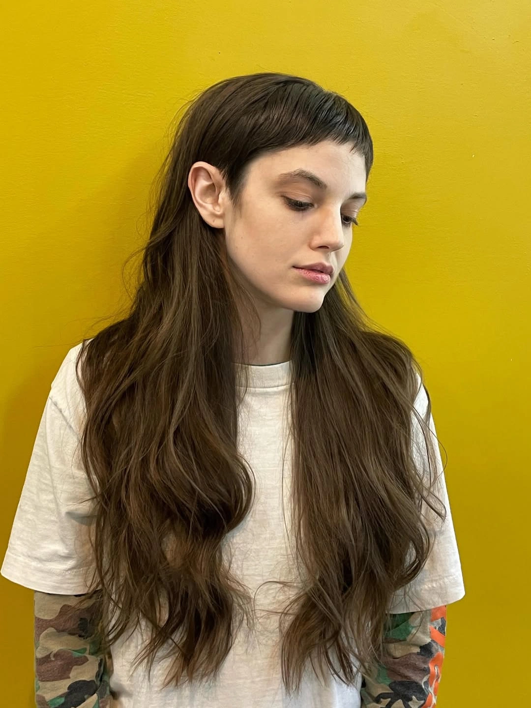 choppy medium layered hair Long Brunette Waves with a Graphic Micro Fringe