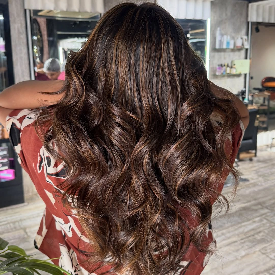 dimensional brunette hair color Glossy Cinnamon Brunette with Flowing Hollywood Waves