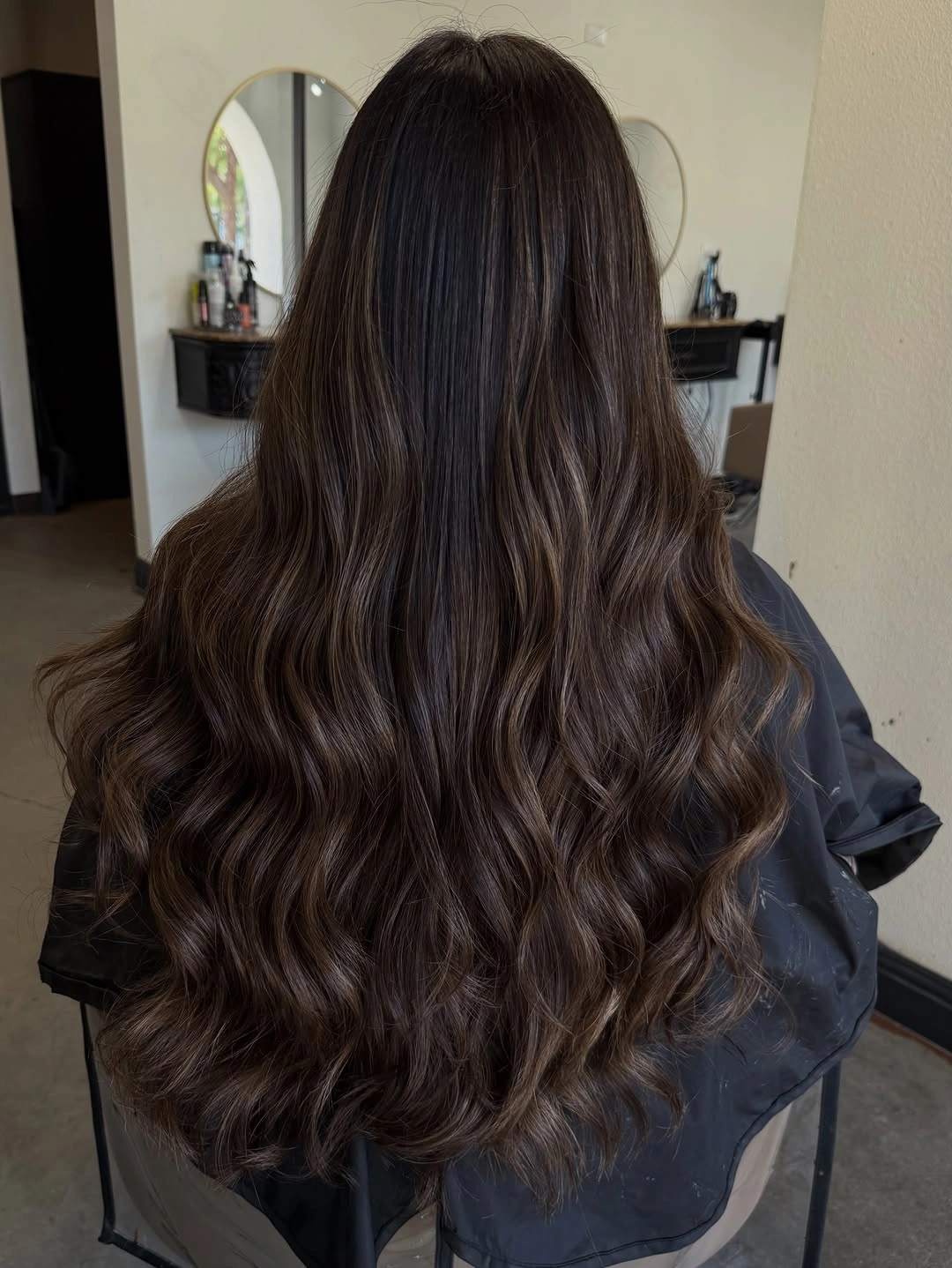 dimensional brunette hair color Classic Chocolate Brunette with Elegant Cascading Waves