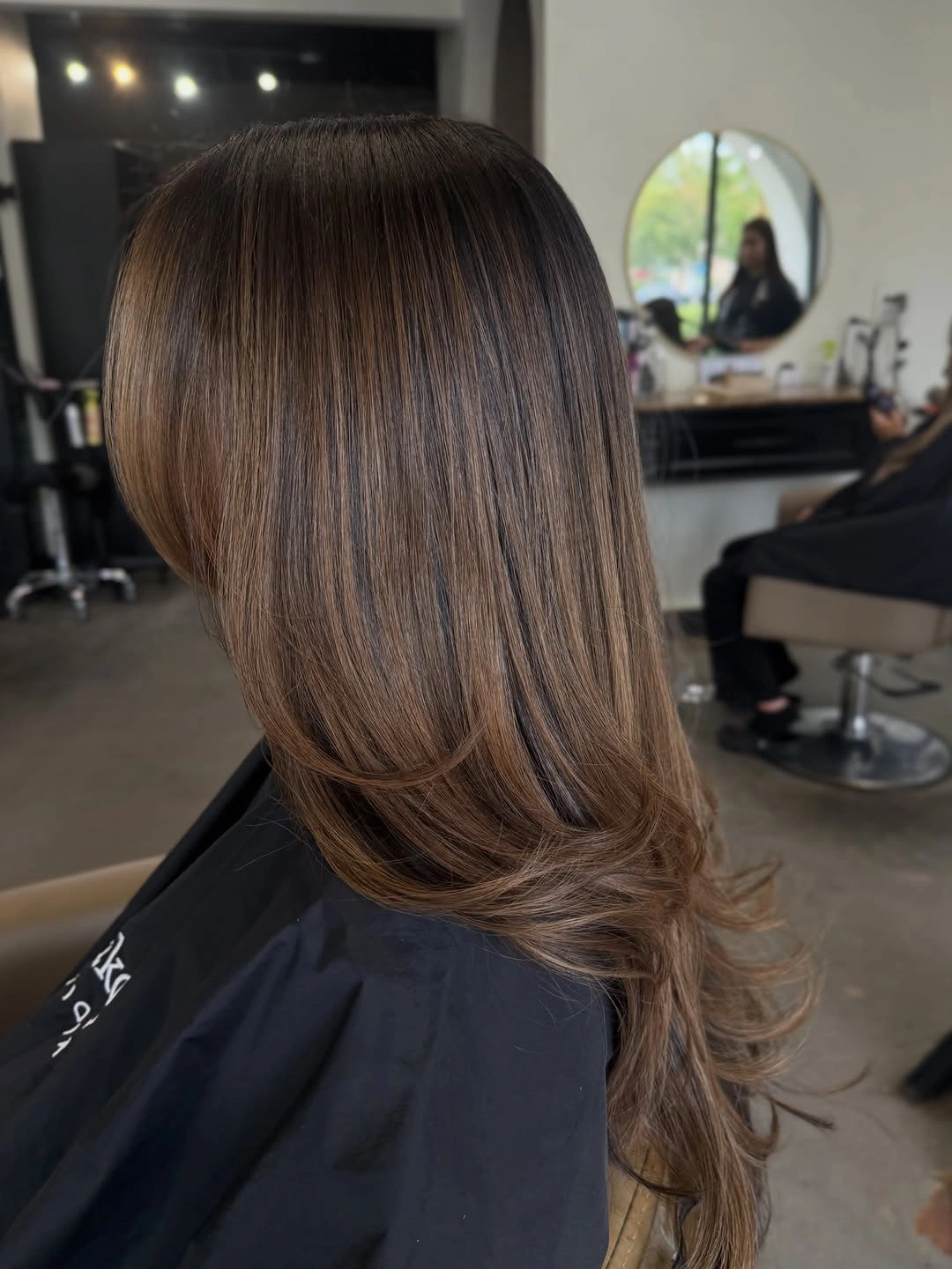 dimensional brunette hair color Silky Beige Brunette Layers with Airy Movement