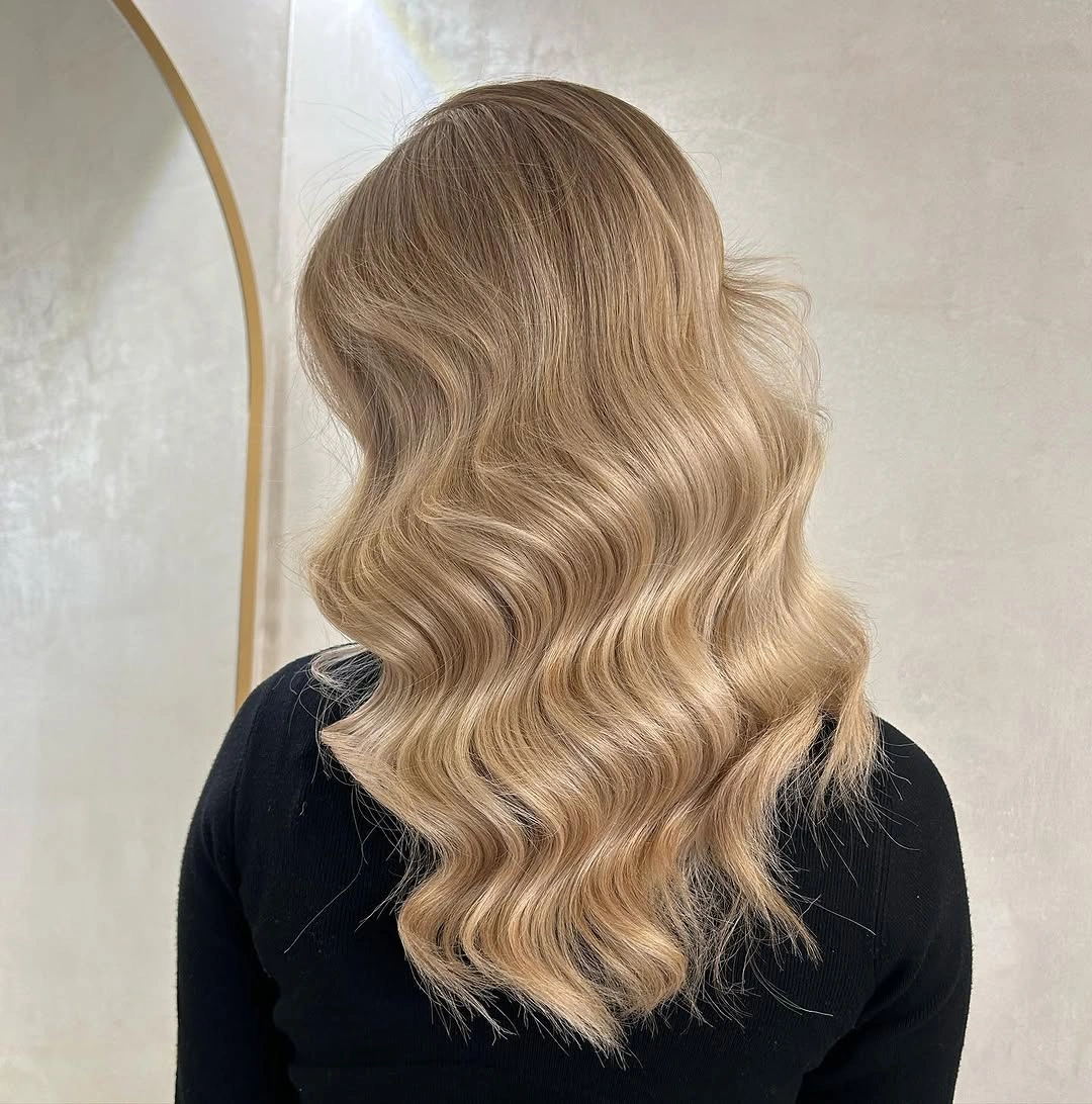 dirty blonde hair color Champagne Dirty Blonde With Soft Vintage Waves