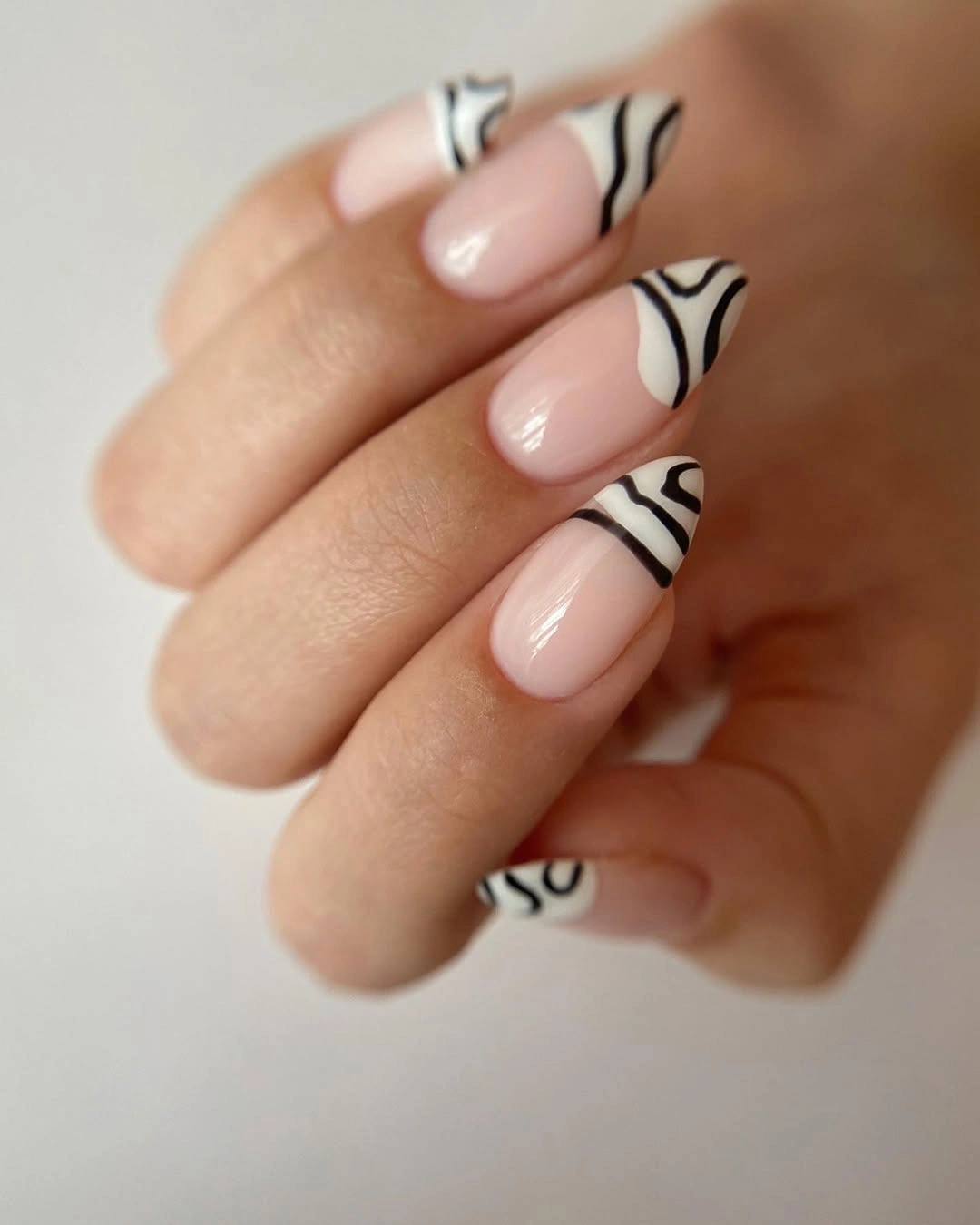 black lined French tip almond nails