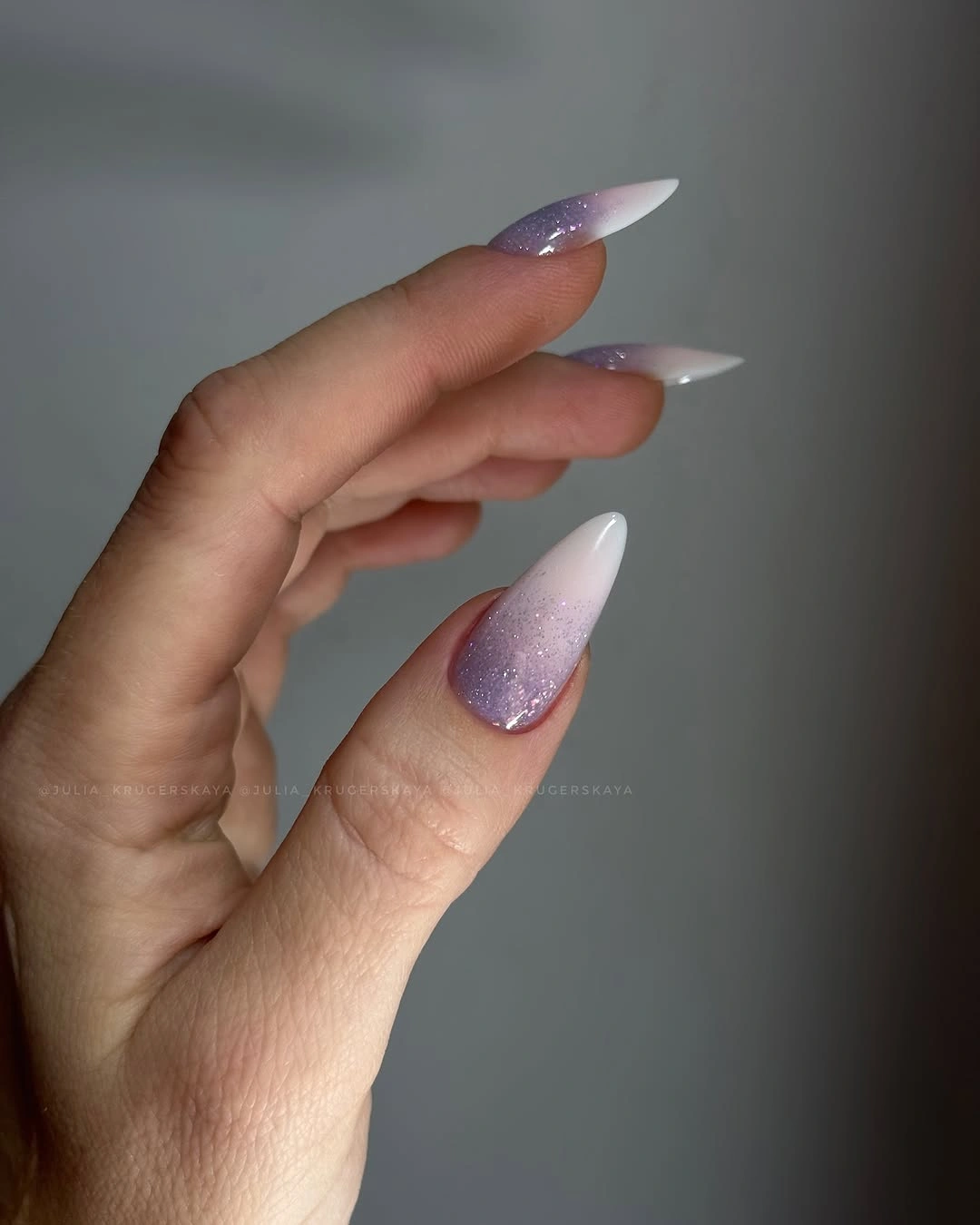 lavender glitter fade almond nails with white tips