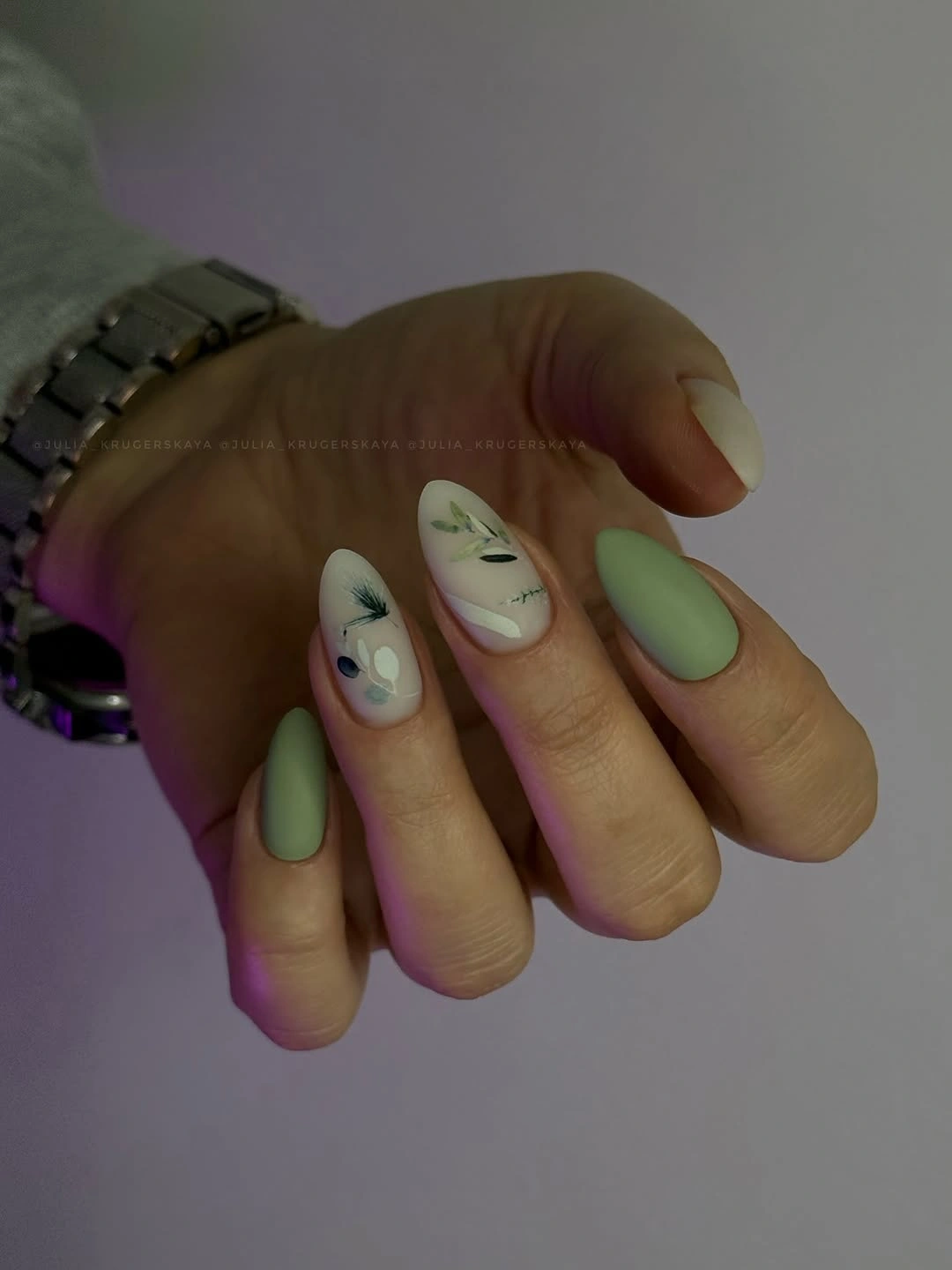 matte sage green almond nails with botanical accents