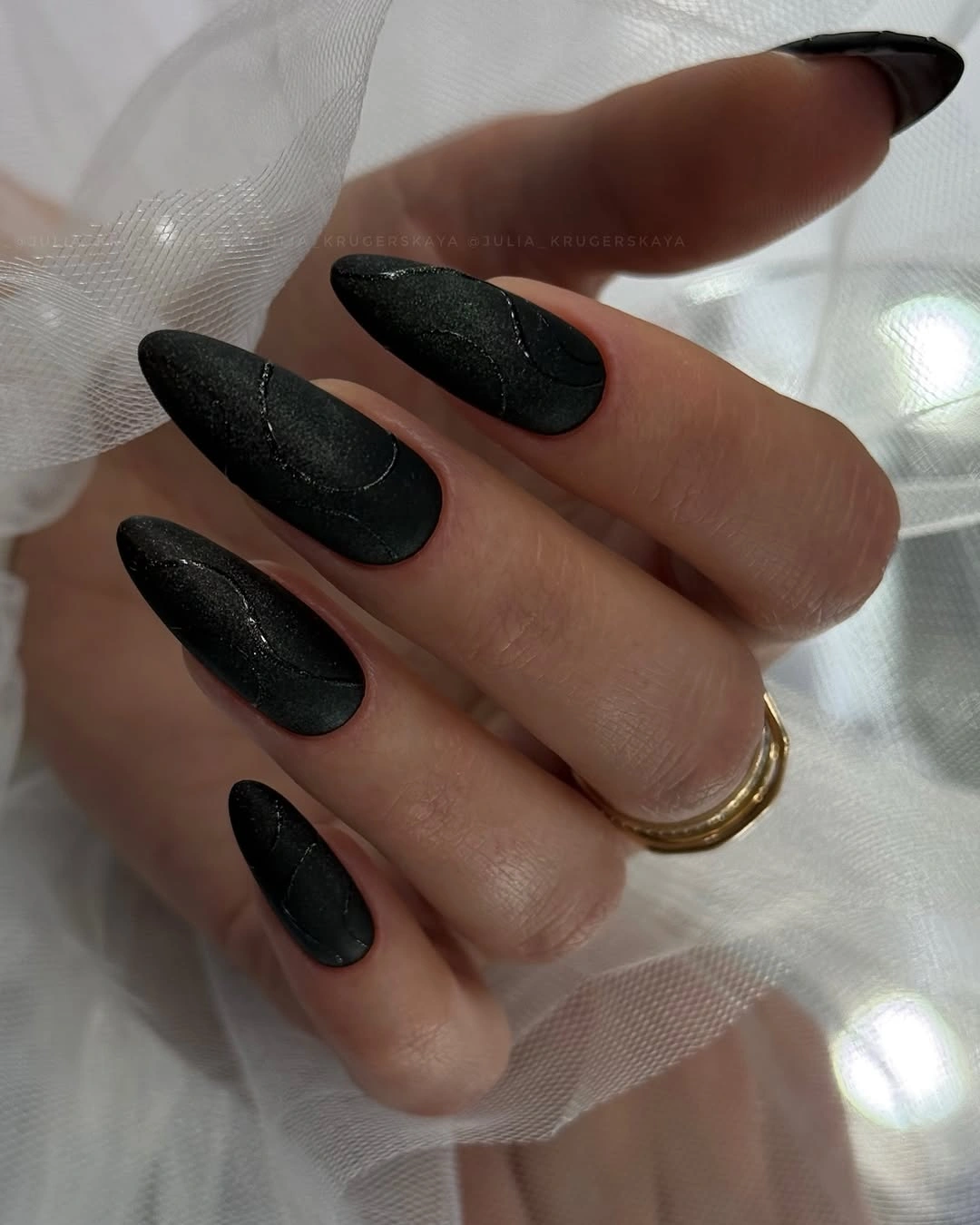textured black long almond nails