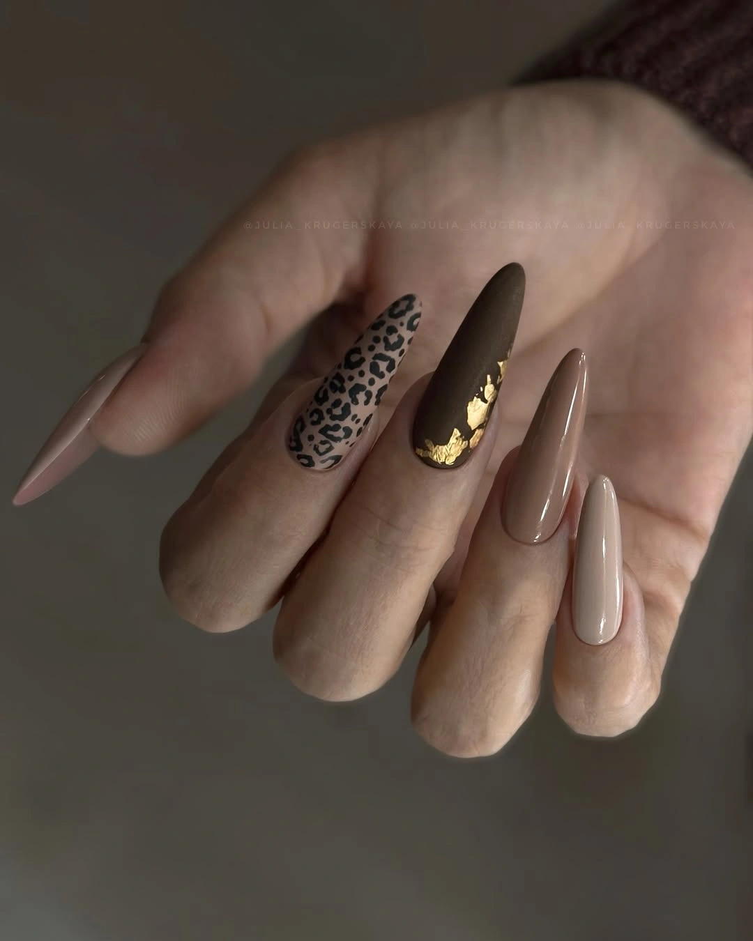 brown leopard almond nails with gold accents