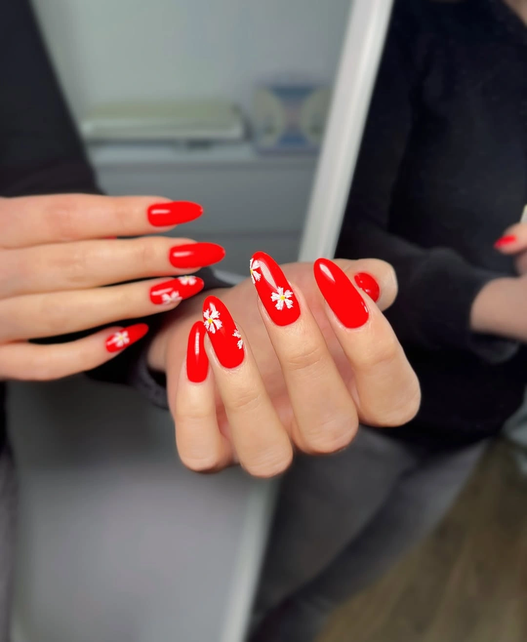 red almond nails with tiny white flowers