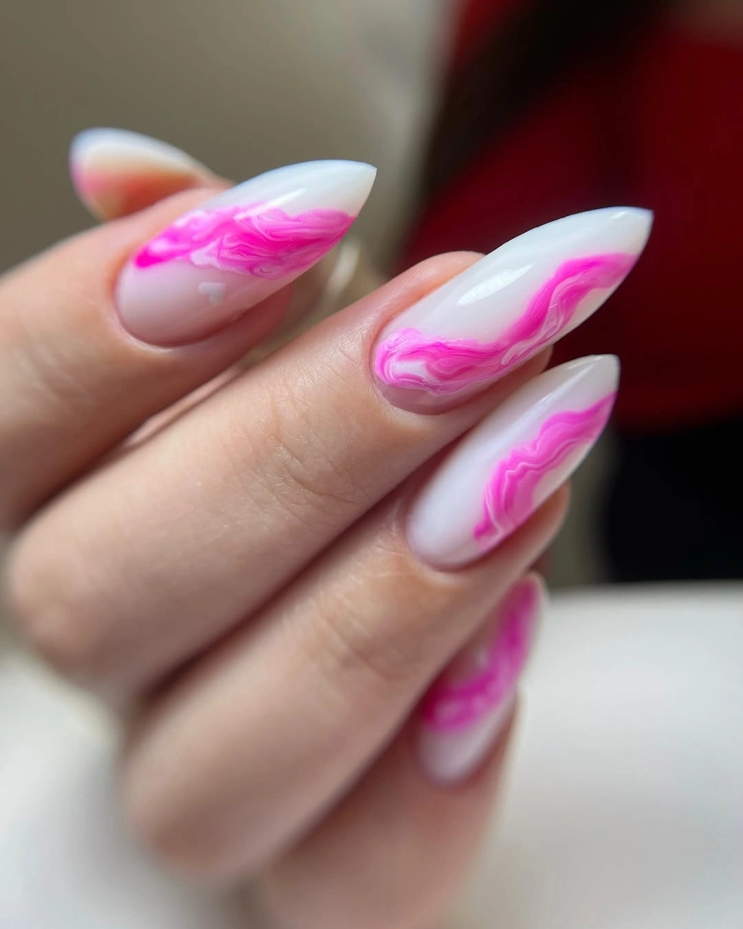 hot pink smoke swirls on white almond nails