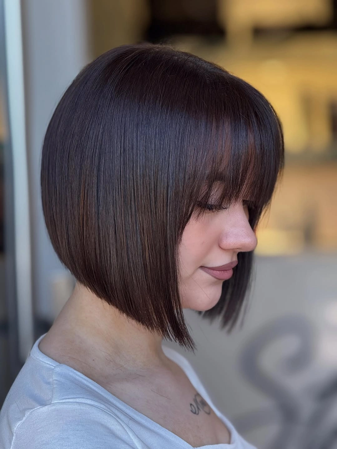 fall bob haircut ideas 2026 Precision Angled Bob With Soft Curtain Fringe