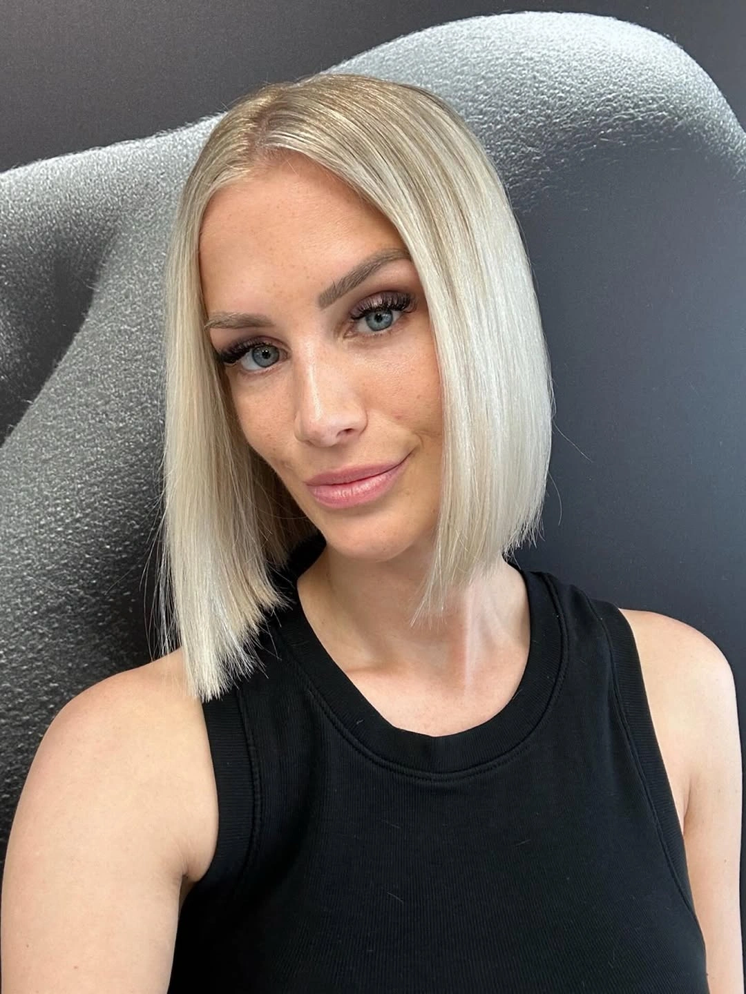 fall bob haircut ideas 2026 Platinum Glass Bob With Razor-Sharp Edges