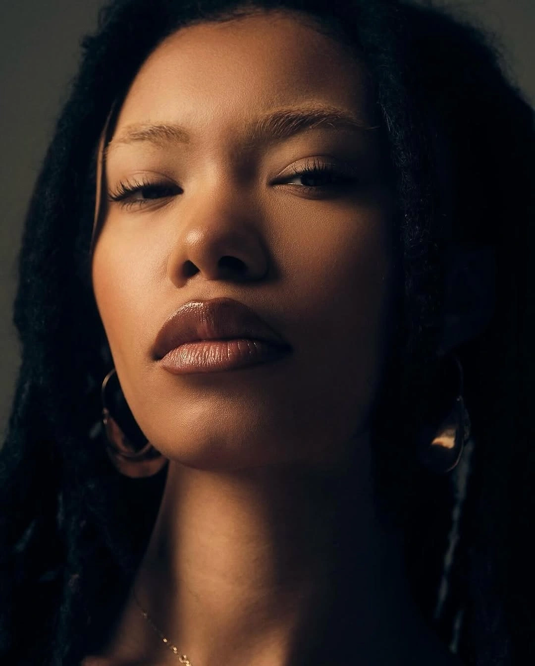 fall hair colors for black women 2026 Classic Jet Black Locs With Understated Elegance