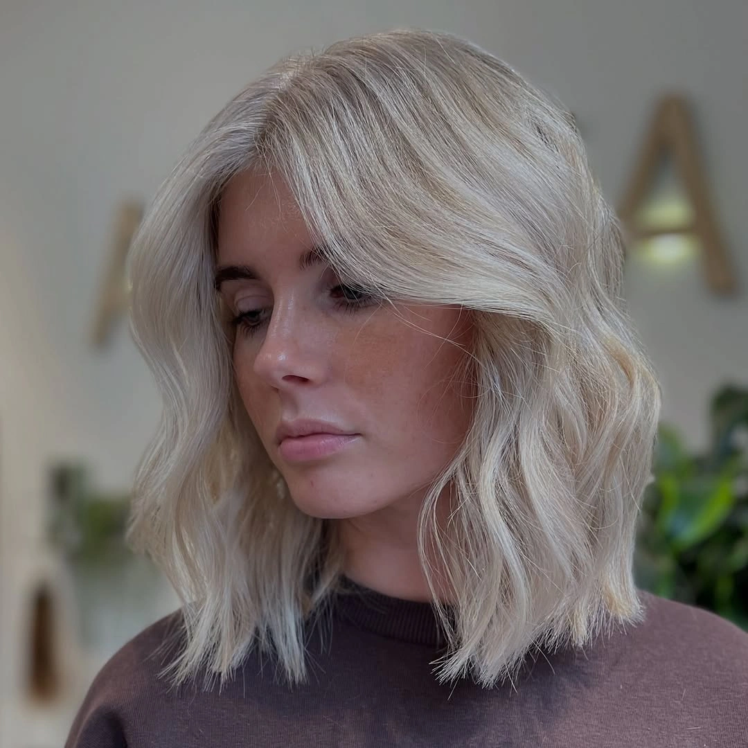 fall haircuts for women 2026 Textured French Bob With Soft Platinum Waves