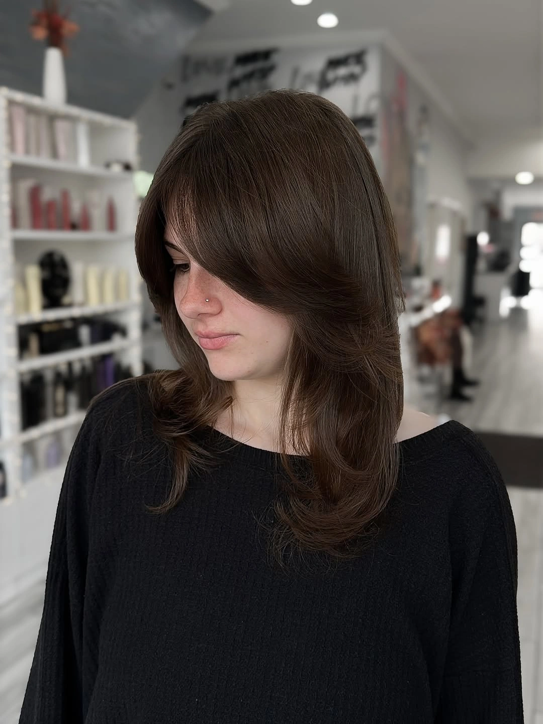 fall haircuts for women 2026 Feathered Chocolate Layers With Seamless Curtain Bangs
