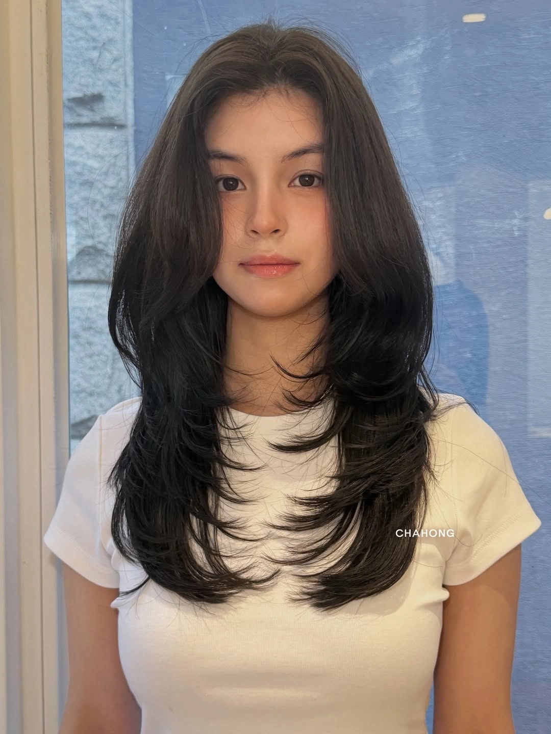 fall haircuts for women 2026 Long Korean-Inspired Layers With Soft Feathered Ends