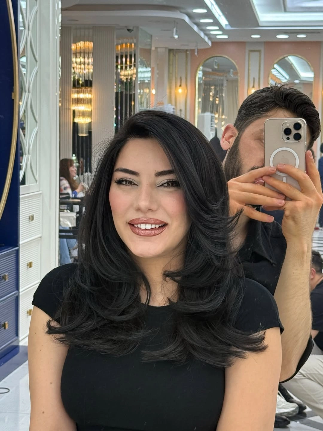 fall haircuts for women 2026 Voluminous Layered Blowout With Luxe Black Shine
