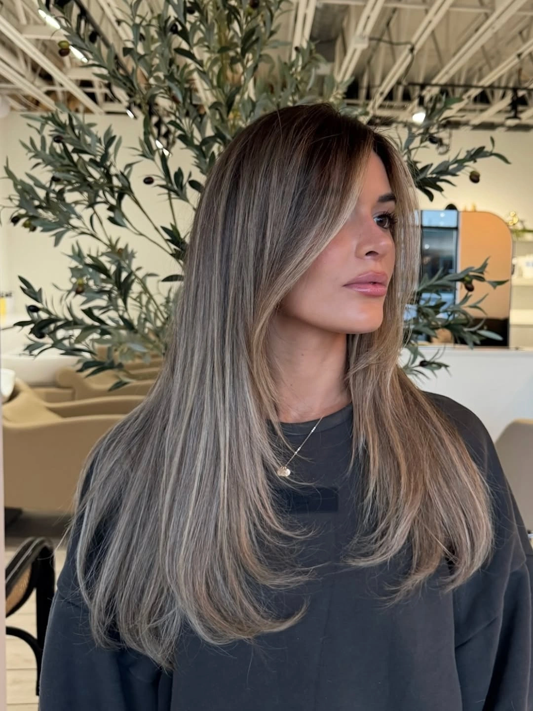fall hairstyles 2026 Feathered Ash Layers with Soft Curtain Framing