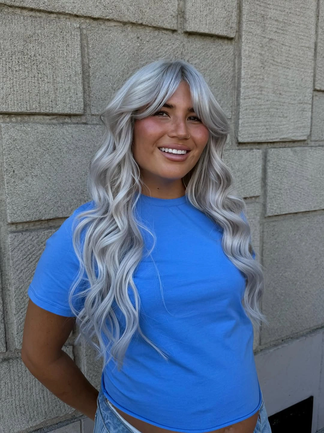 fall hairstyles 2026 Long Silver Waves with Curtain Bangs for a Modern Statement