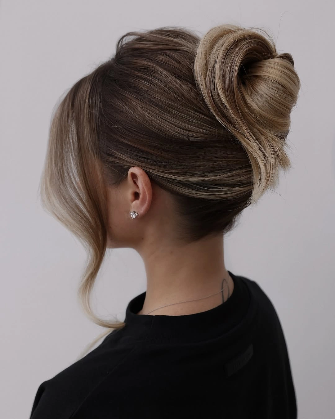Fall hairstyles for office 2026 Elegant French Twist Bun with Modern Sleek Finish