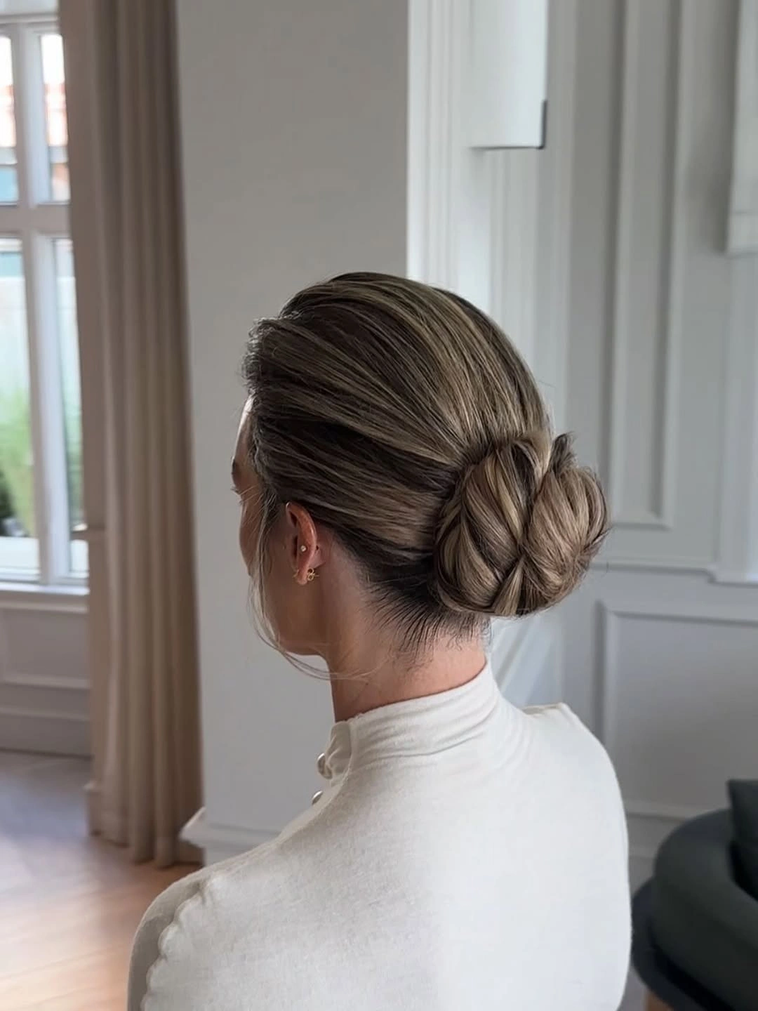 Fall hairstyles for office 2026 Classic Low Chignon with Sleek Side Part