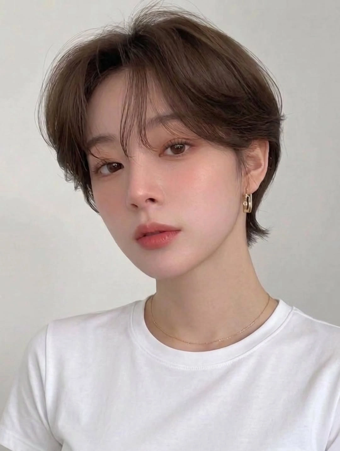 Fall hairstyles for short hair 2026 Soft Korean Pixie Bob with Airy Curtain Bangs