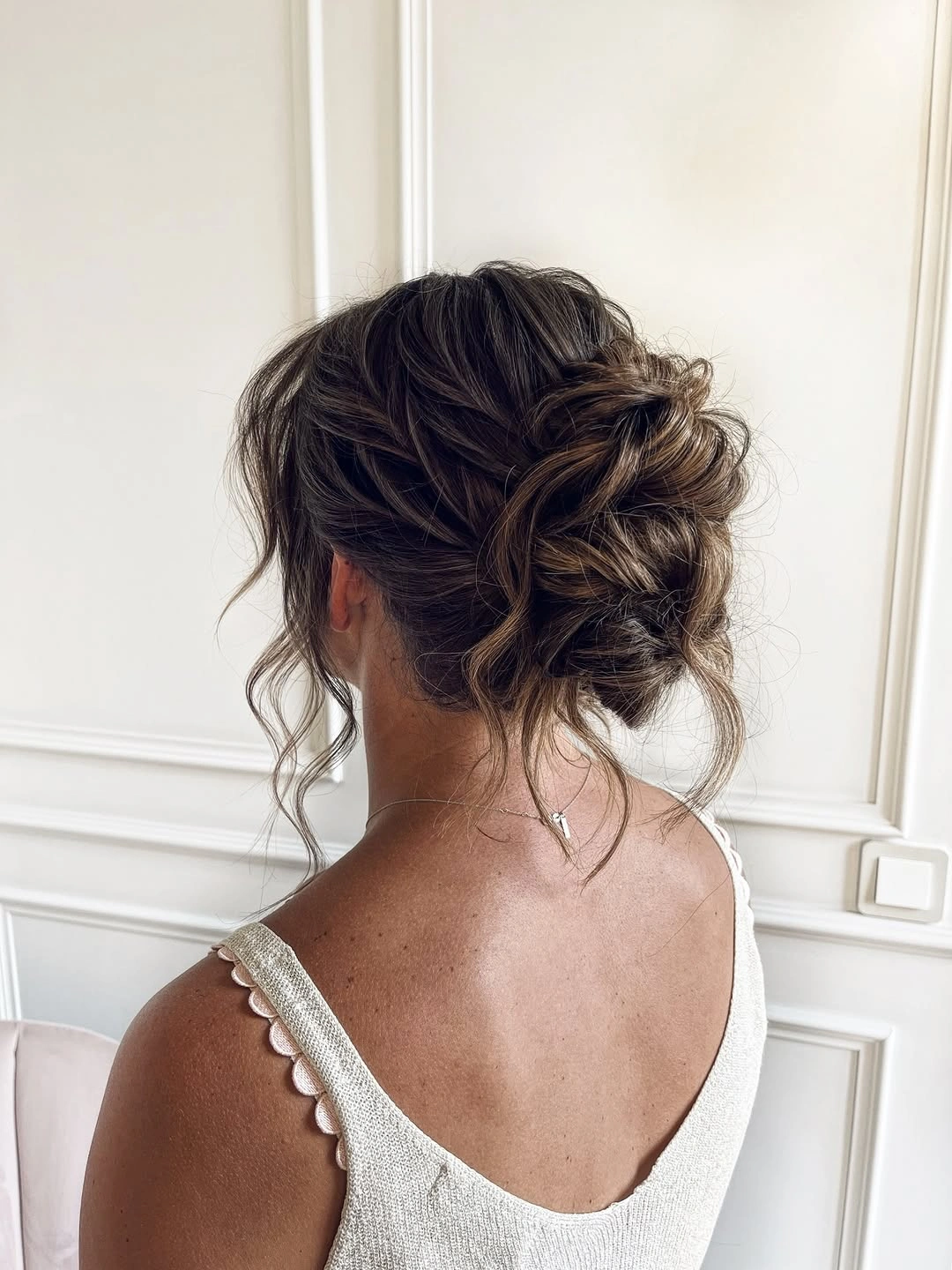 Fall hairstyles for wedding guests 2026 Romantic Textured Low Chignon with Effortless Volume