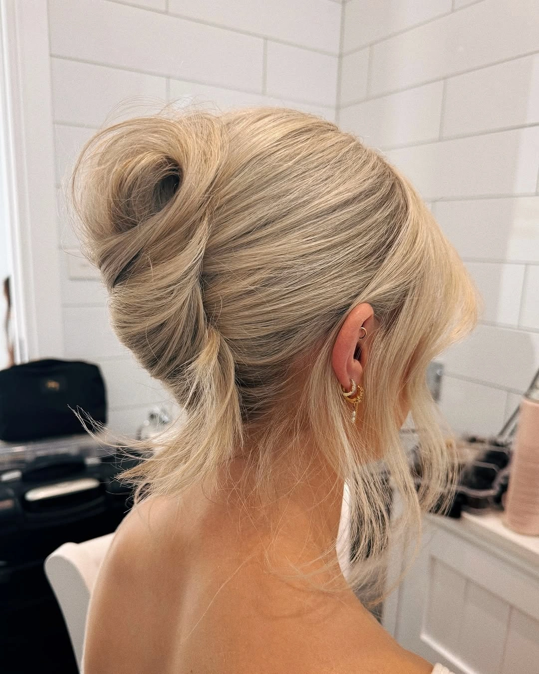 Fall hairstyles for wedding guests 2026 Modern Sculptural Blonde French Twist
