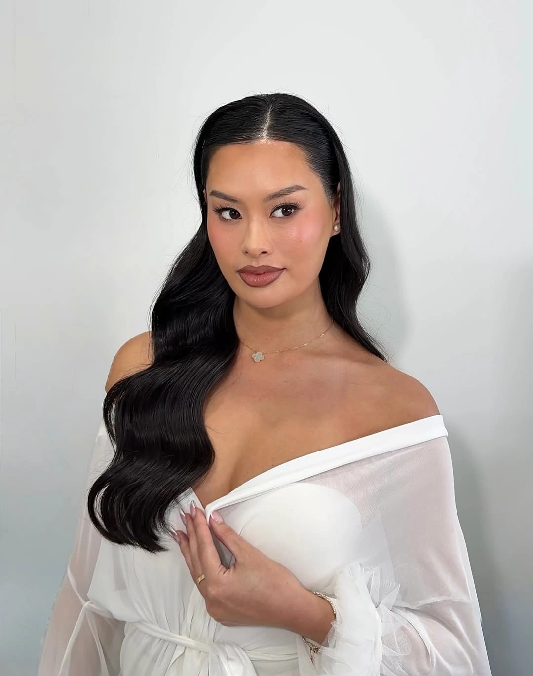 Fall hairstyles for wedding guests 2026 Soft Glam Side-Part Waves with Mirror-Like Shine