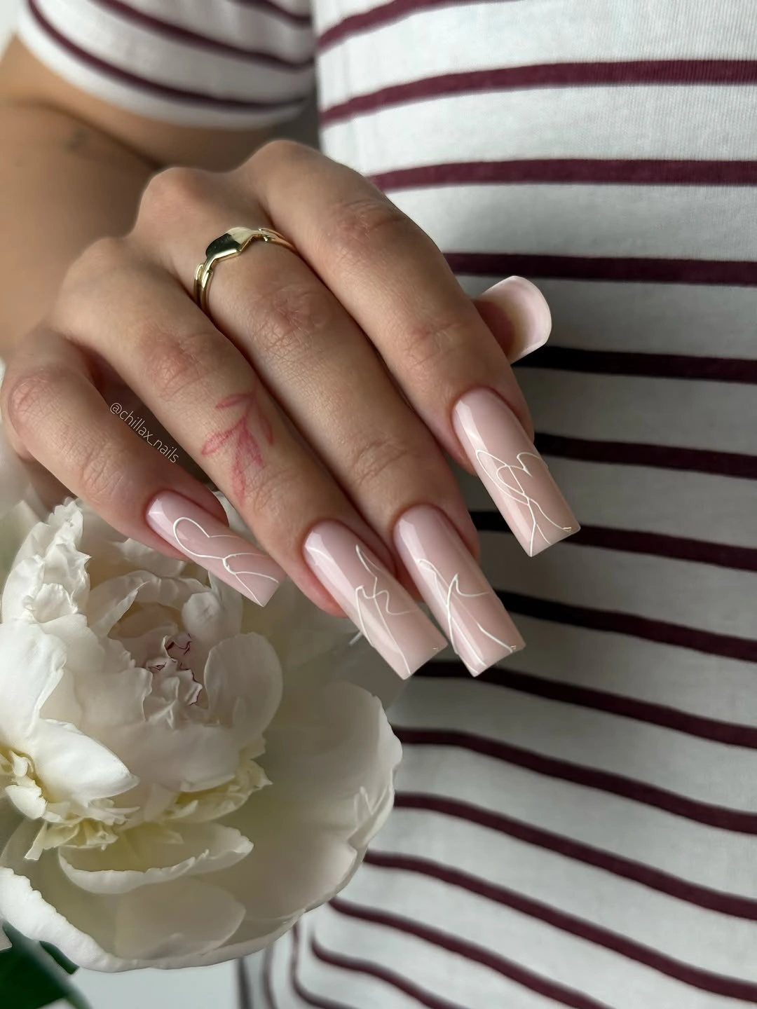 long sheer pink square nails with crisp white french tips